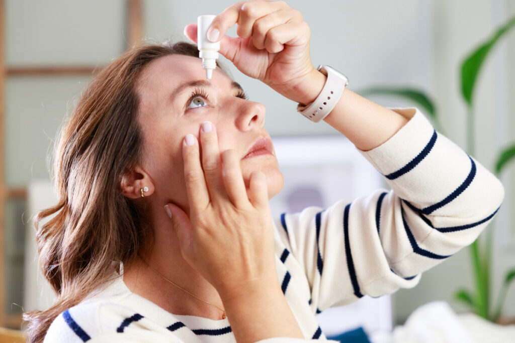 Woman with dry eyes after LASIK using eye drops