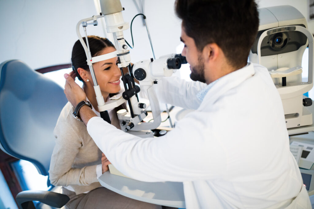 Optometrist performing regular eye exam